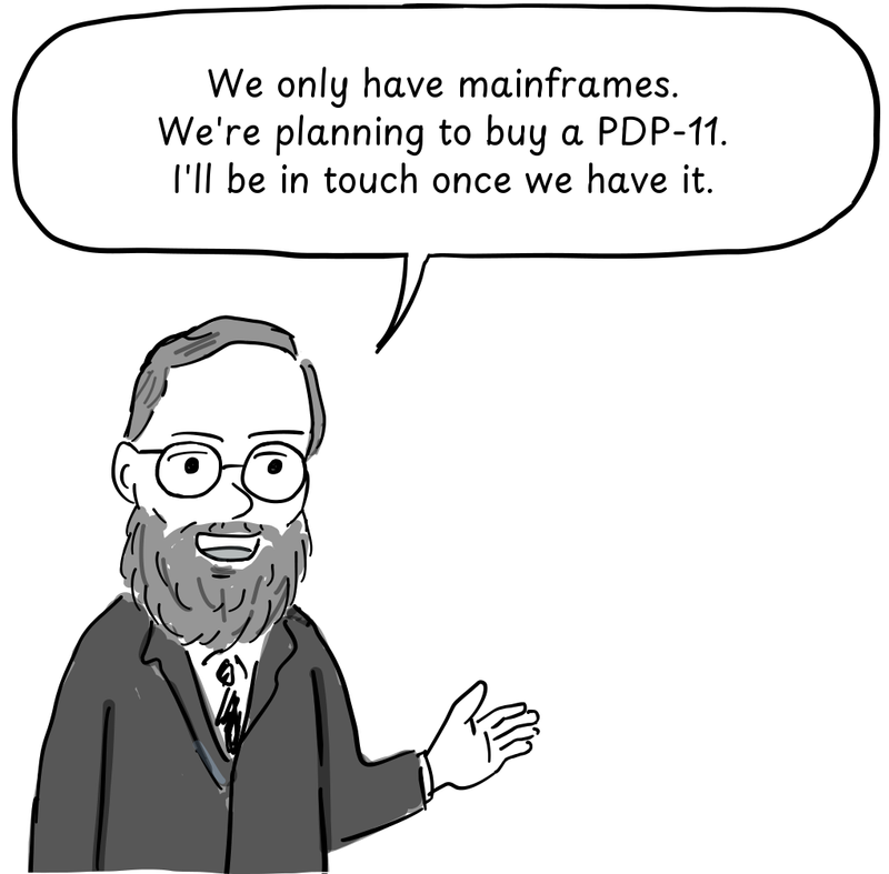 Fabry gestures with an open hand as he explains what computers Berkeley has.